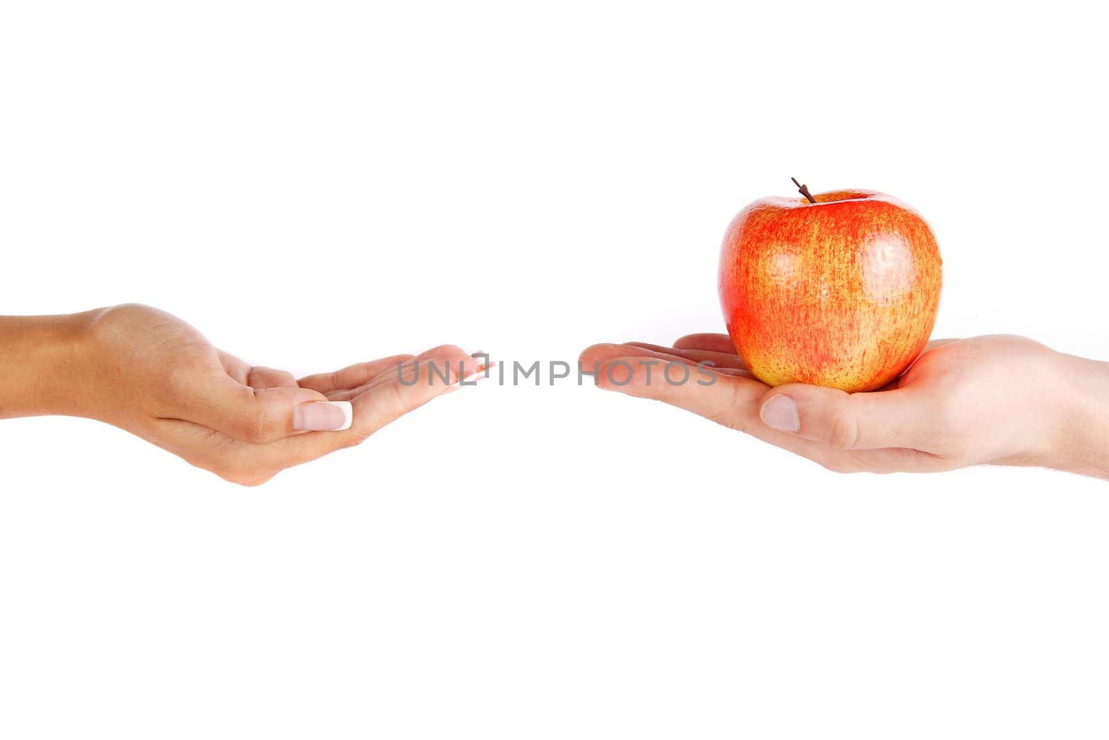 Mans hand is giving an apple to the women hand by ozaiachin