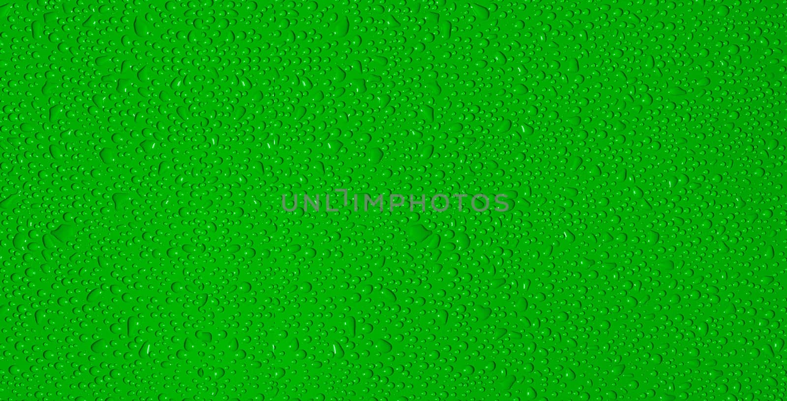 drops of water on a green background by ozaiachin