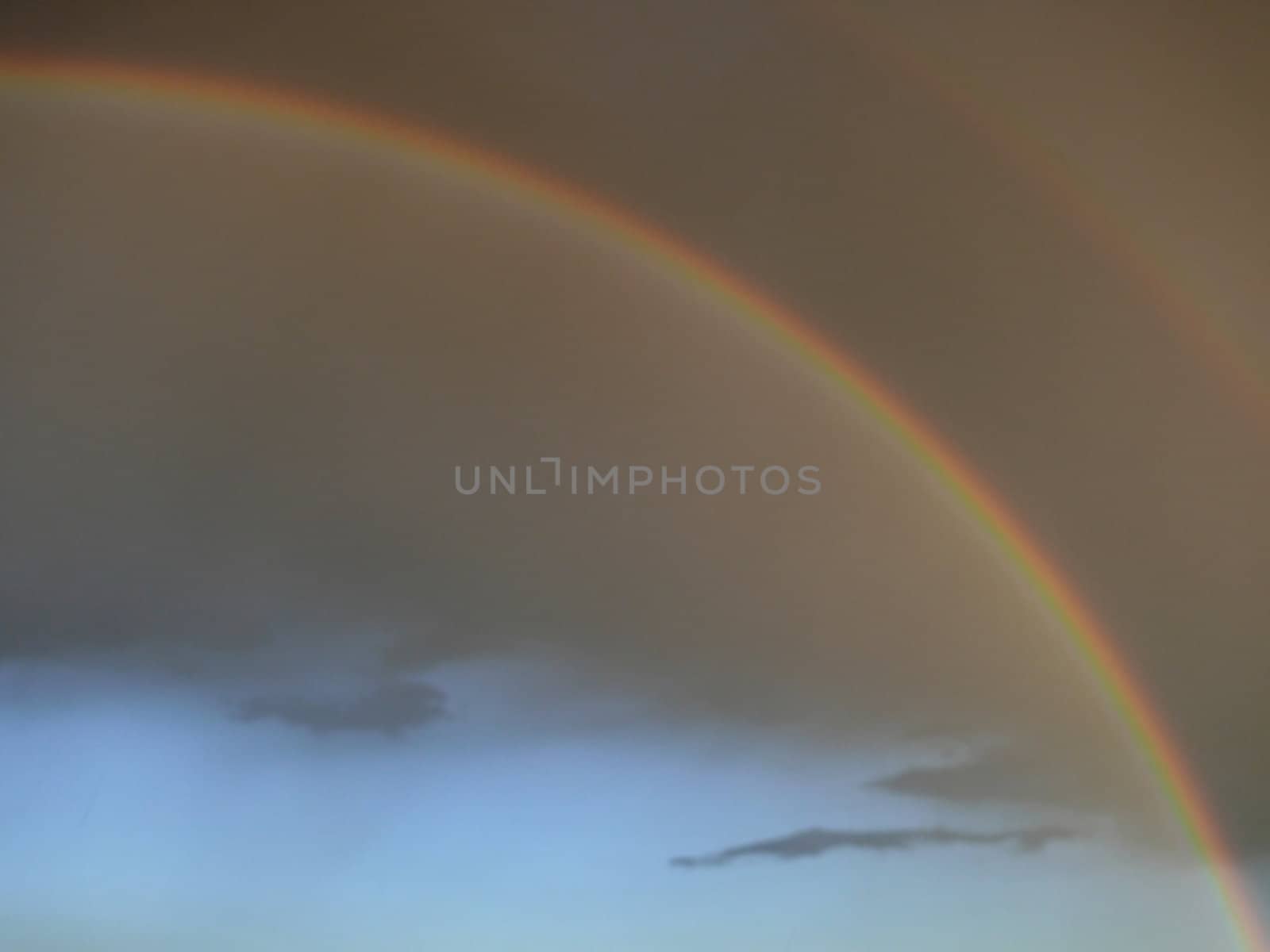 rainbow and gray clouds