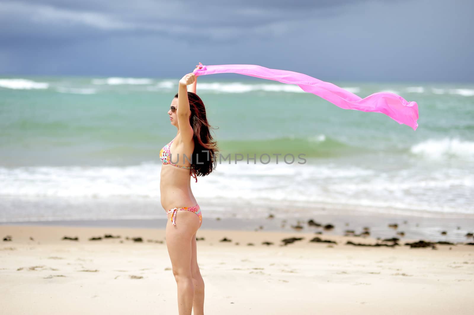 Woman enjoying the beach in Salvador de Bahia, Brazil