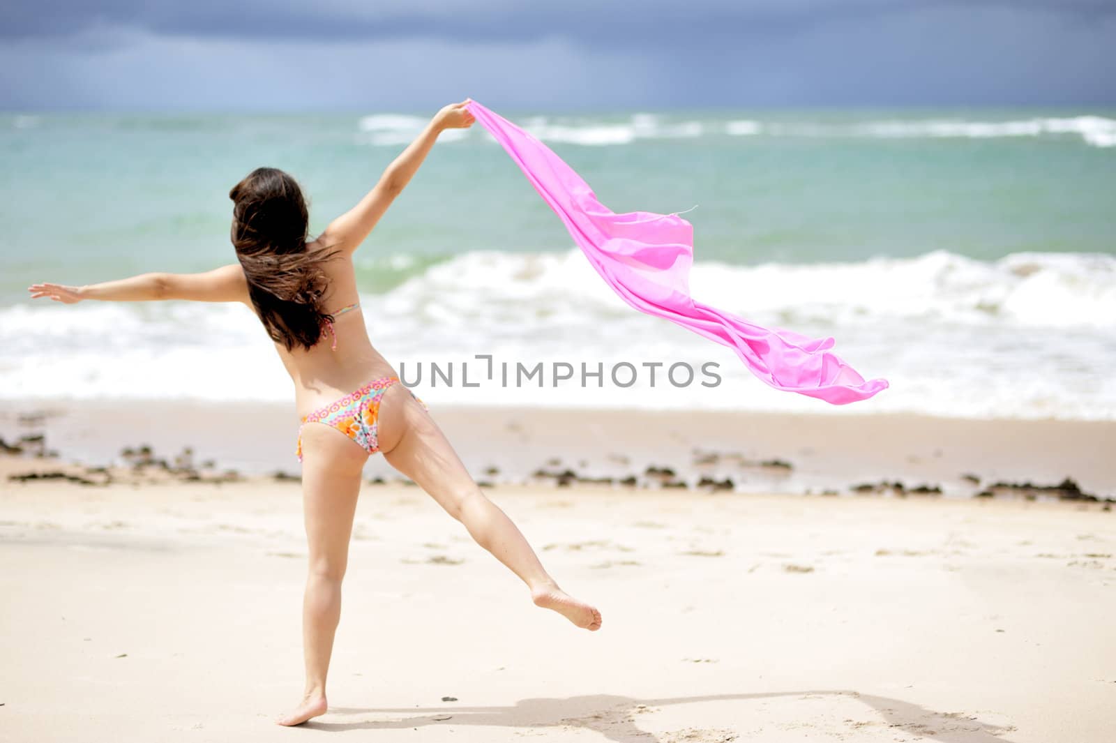 Woman enjoying the beach in Salvador de Bahia, Brazil