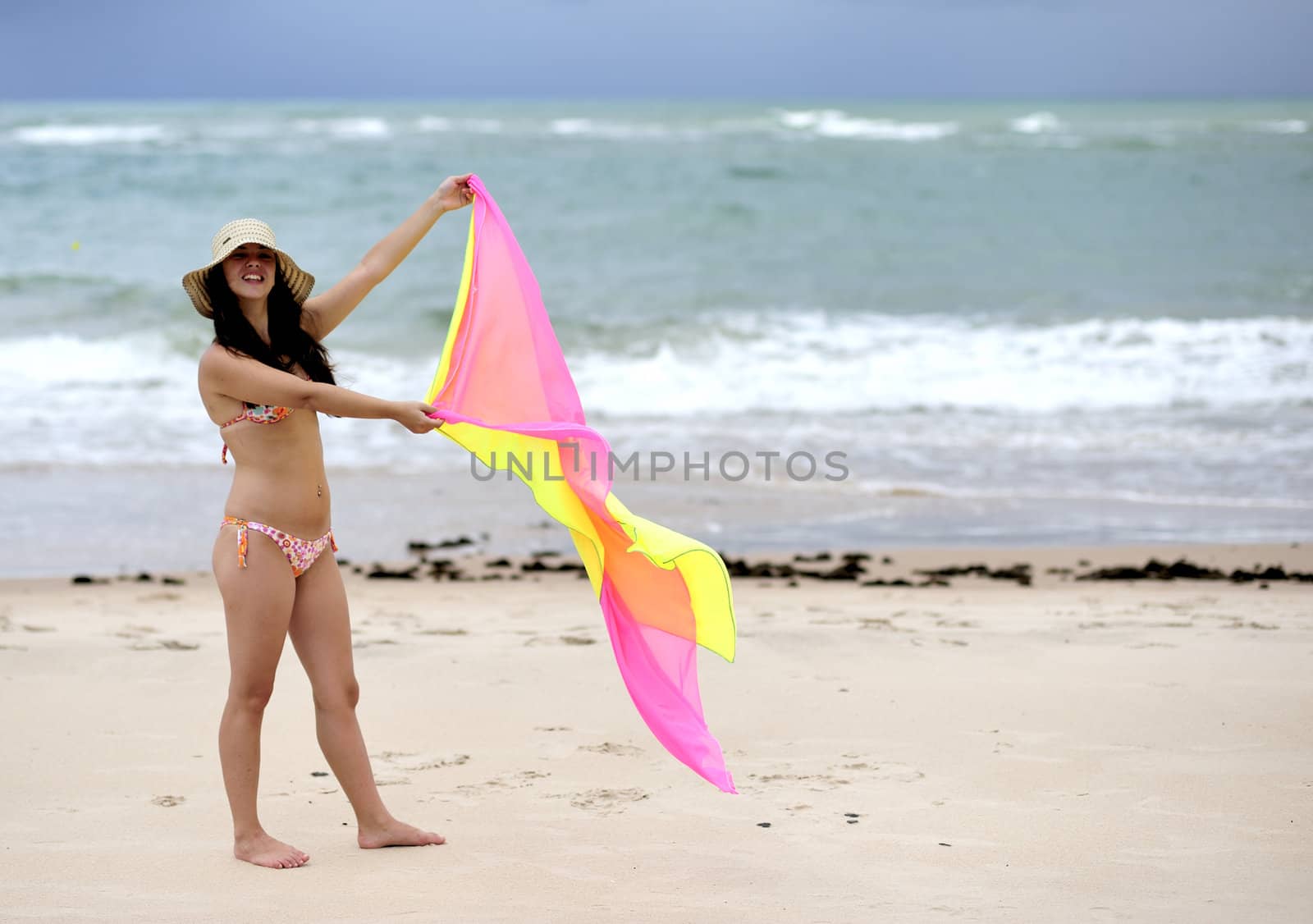 Woman enjoying the beach in Salvador de Bahia, Brazil