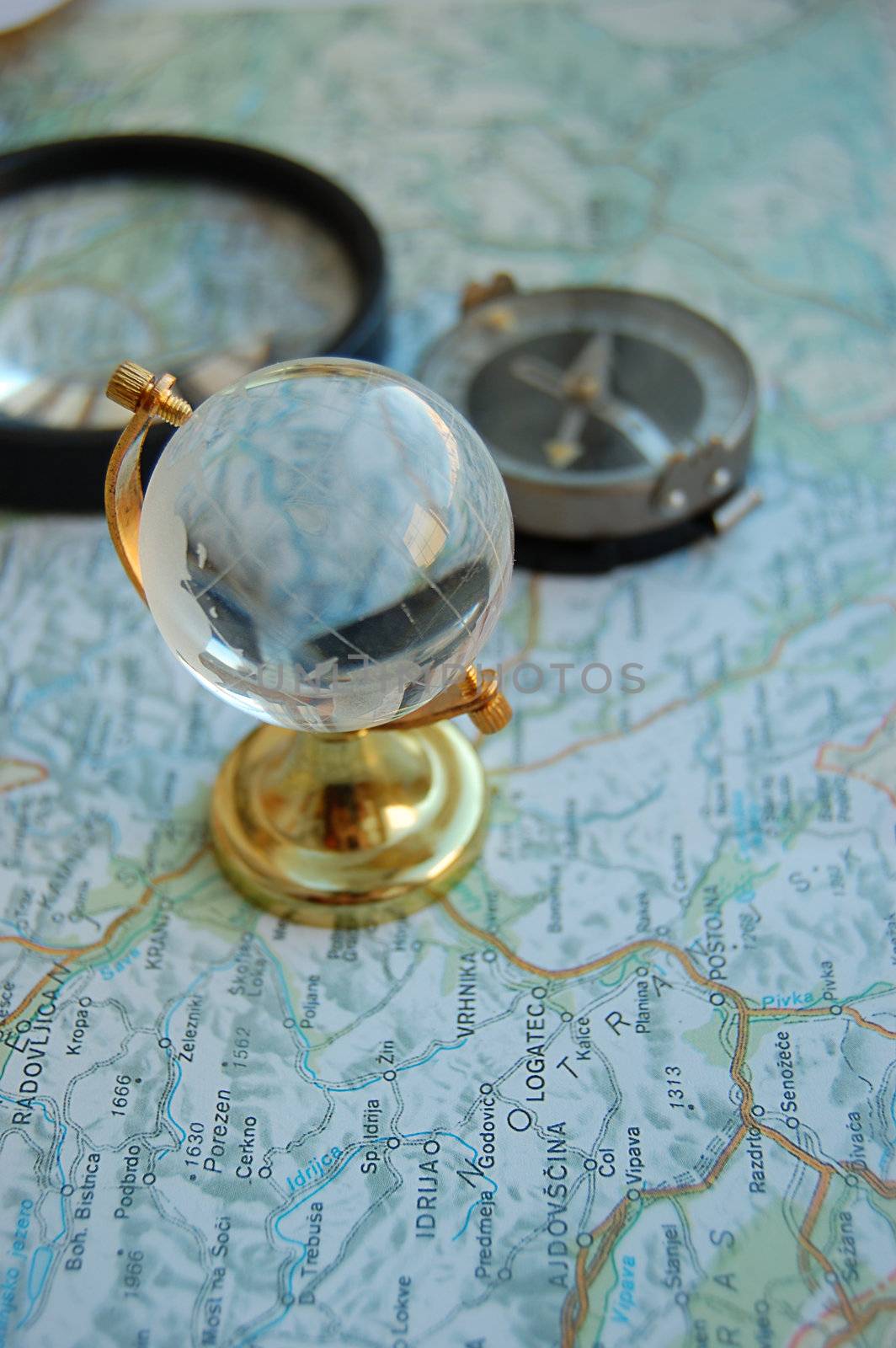 Map, globe and magnifying glass