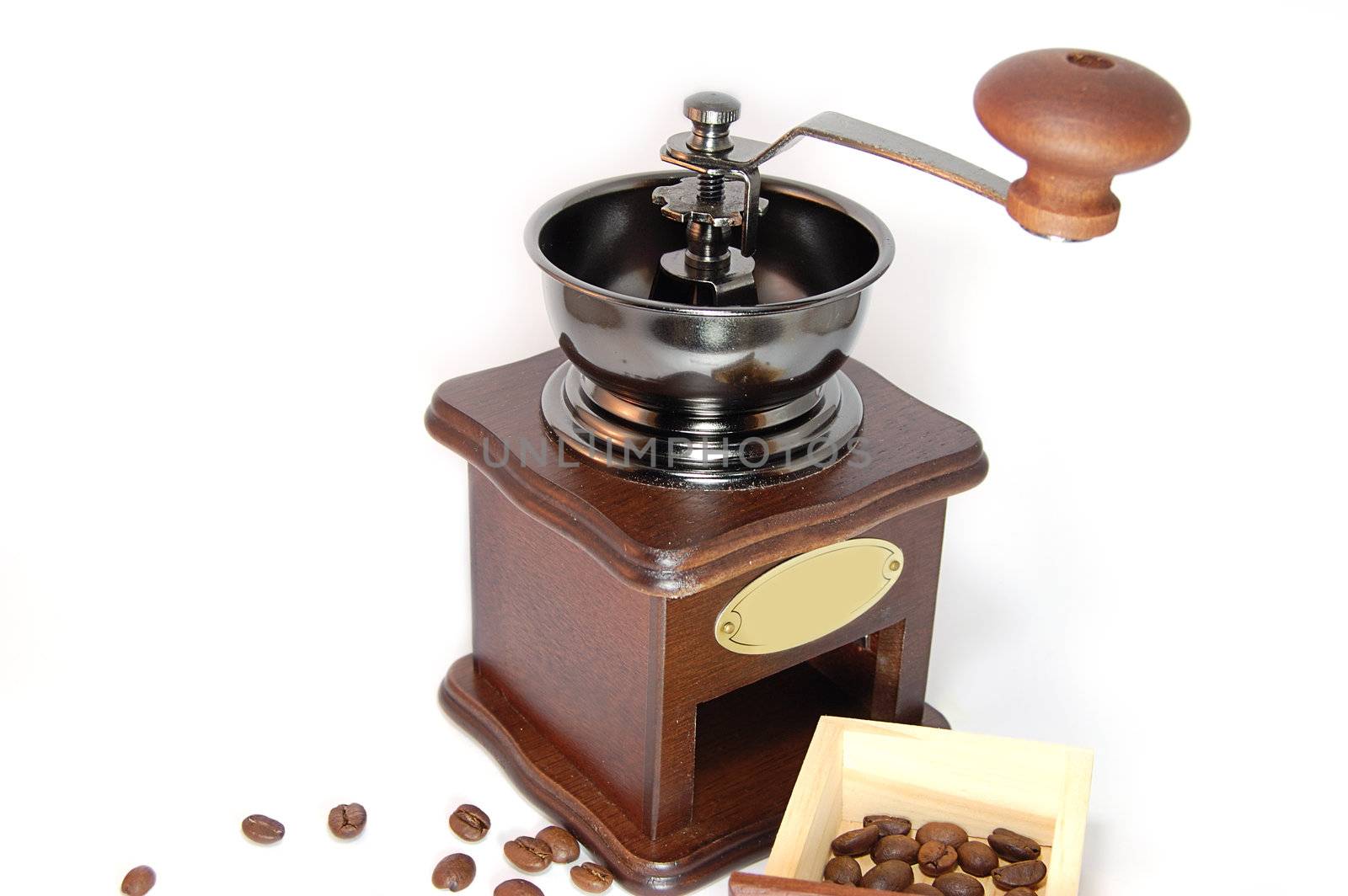 Coffee grinder with beans isolated on white