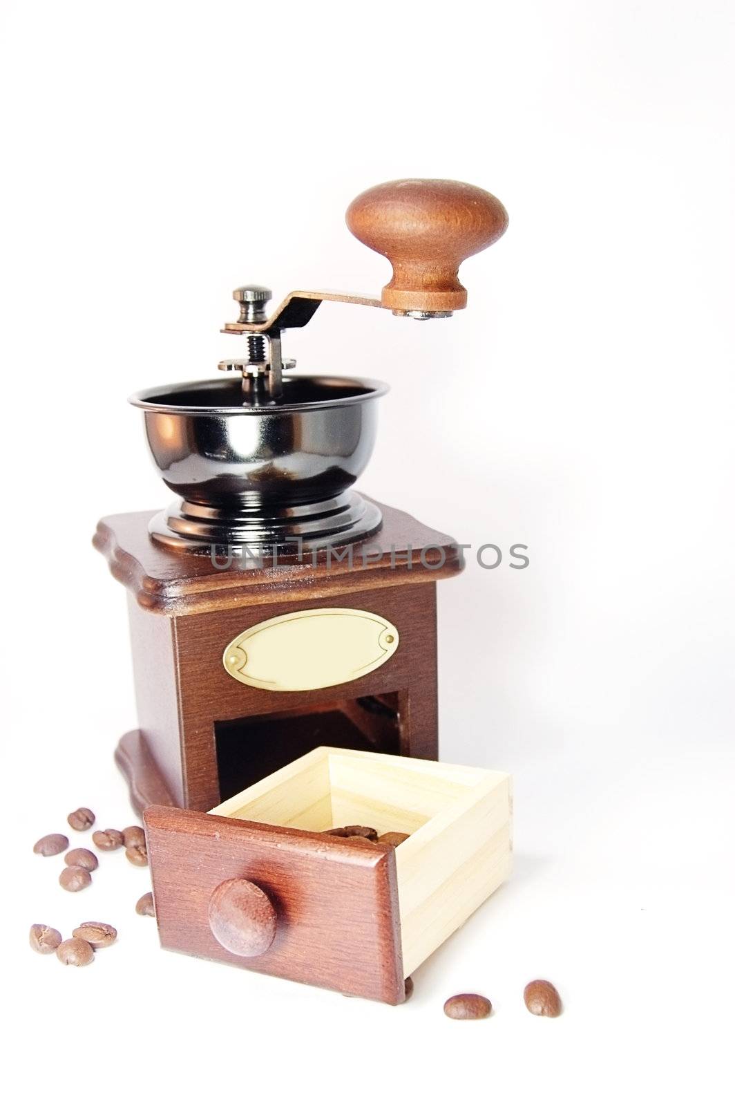 Coffee grinder with beans isolated on white