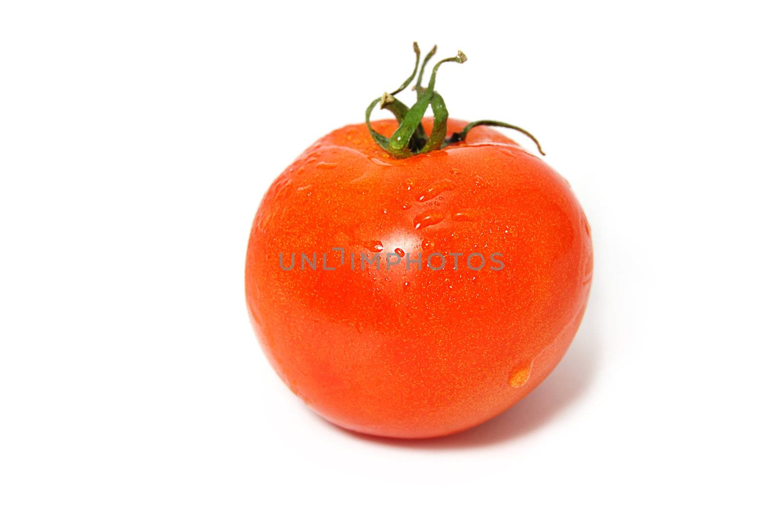 One red tomato with green ends isolated on white