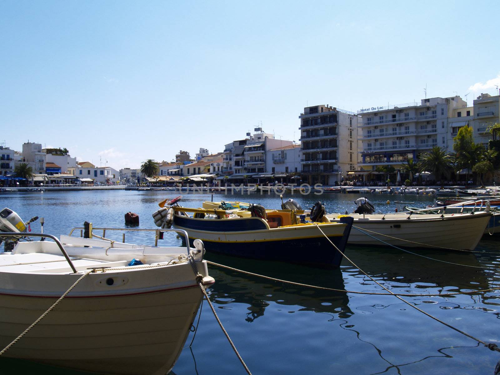 fishing boats on lake voulismeni, crete, greece