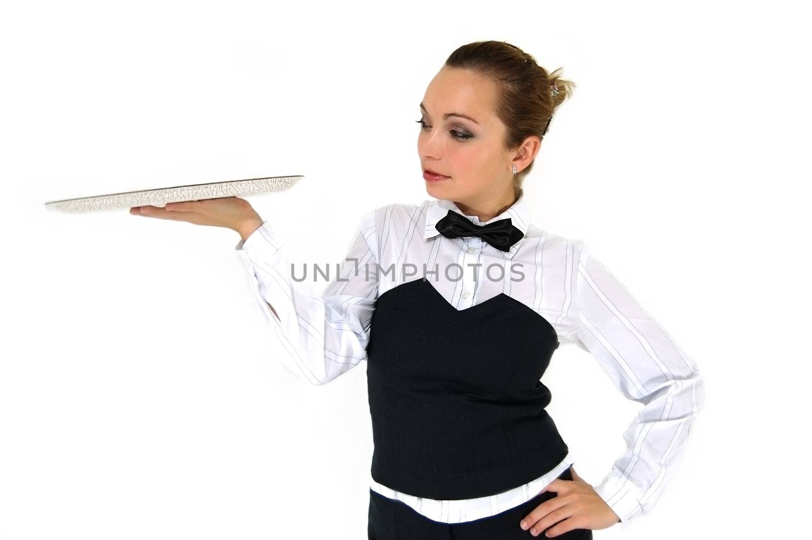 Waitress in uniform and necktie holding empty tray on white