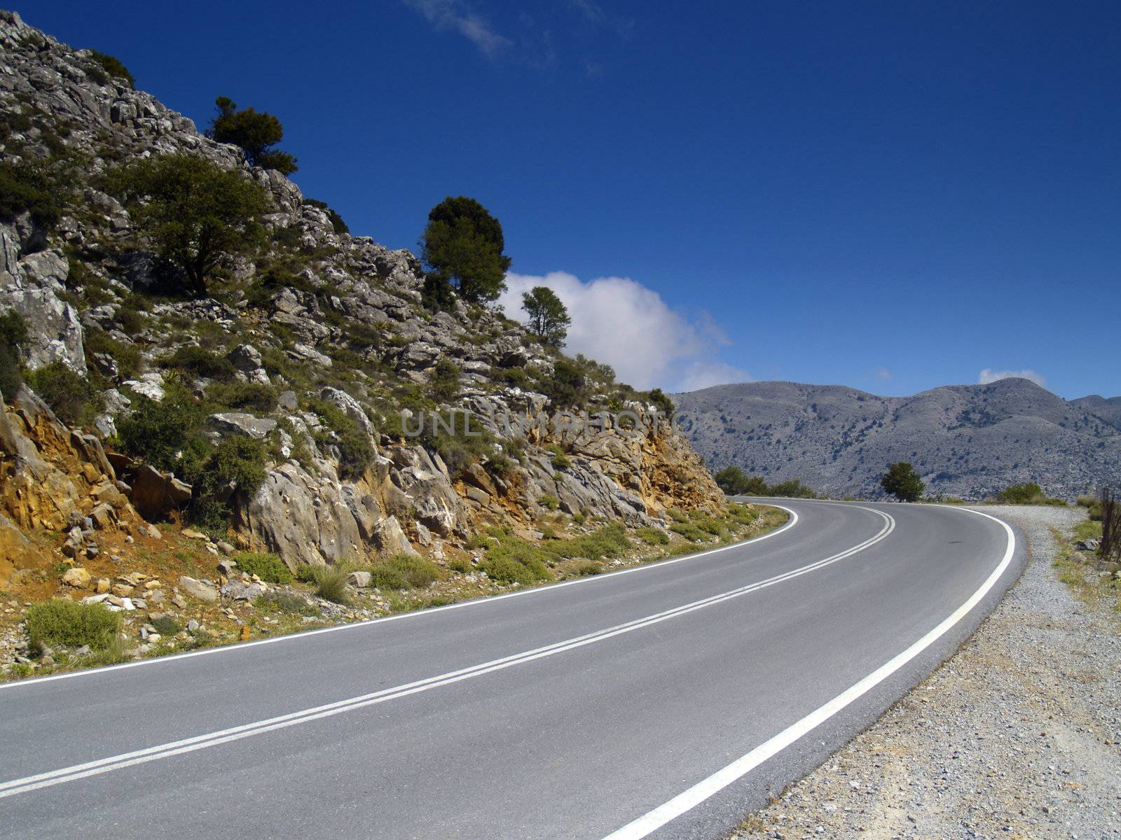 road in cretan mountains on a bright sunny day