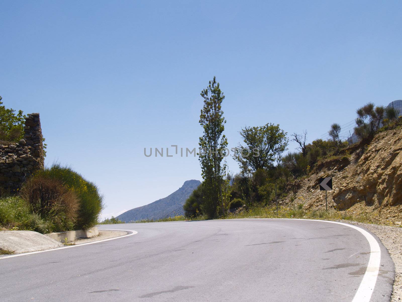 road in cretan mountains on a bright sunny day