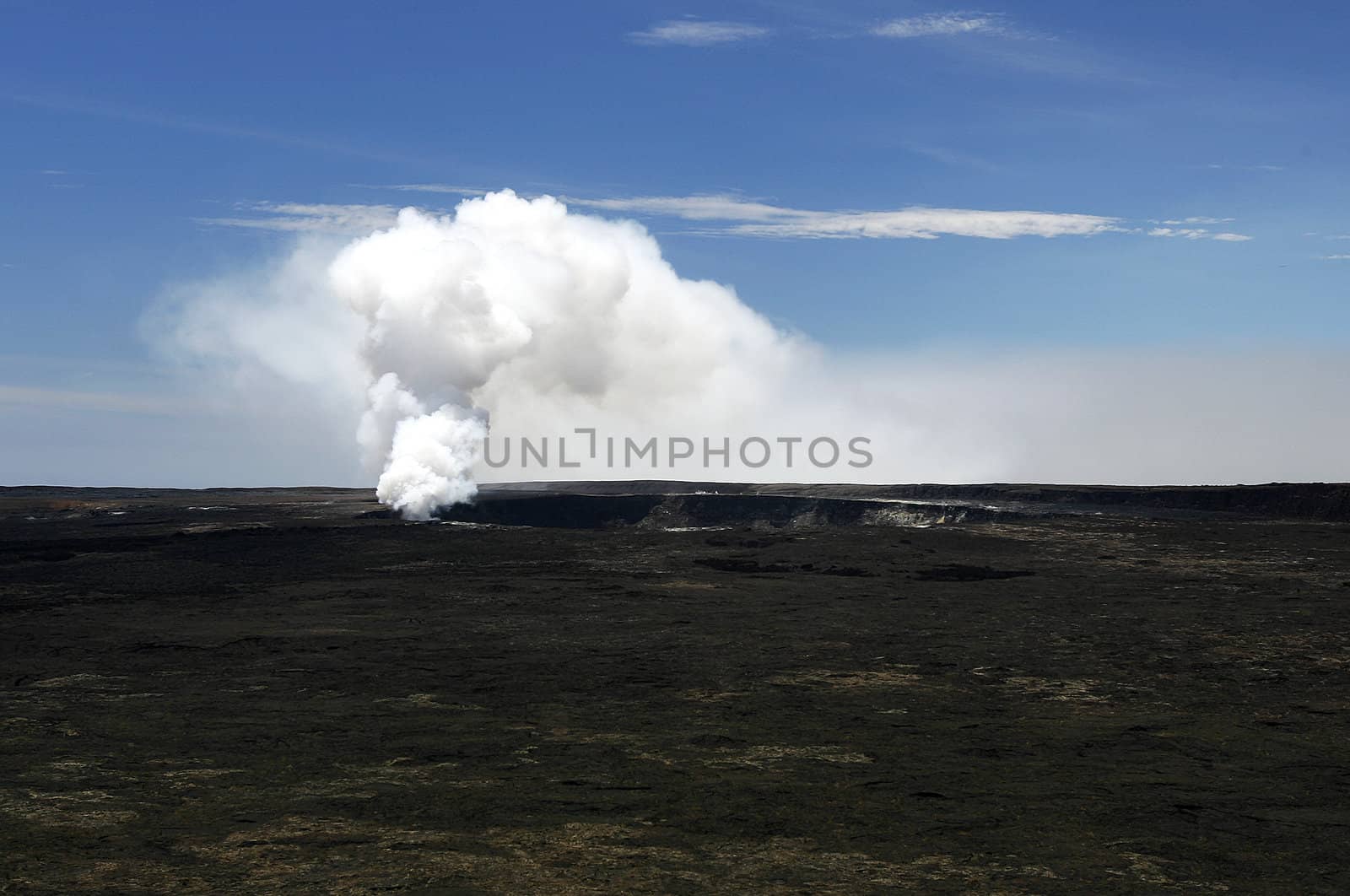 A plume of smoke coming out of a vent at Hualalai Volcano