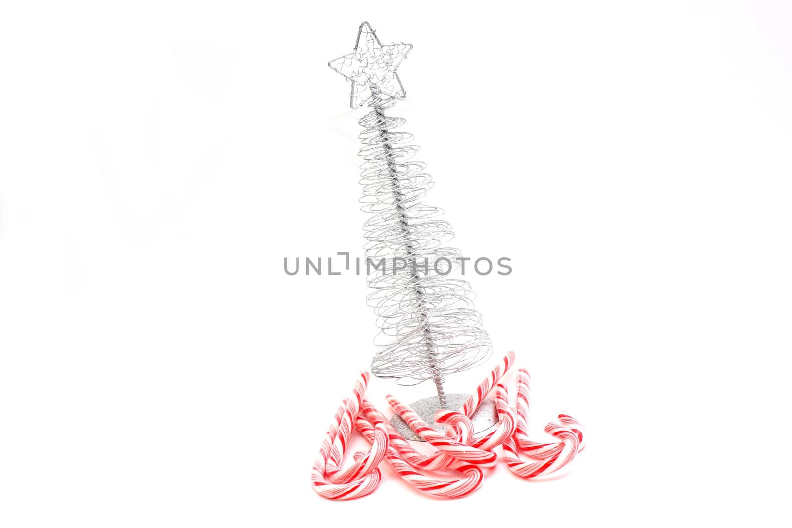 Christmas Tree and candy canes on white background.