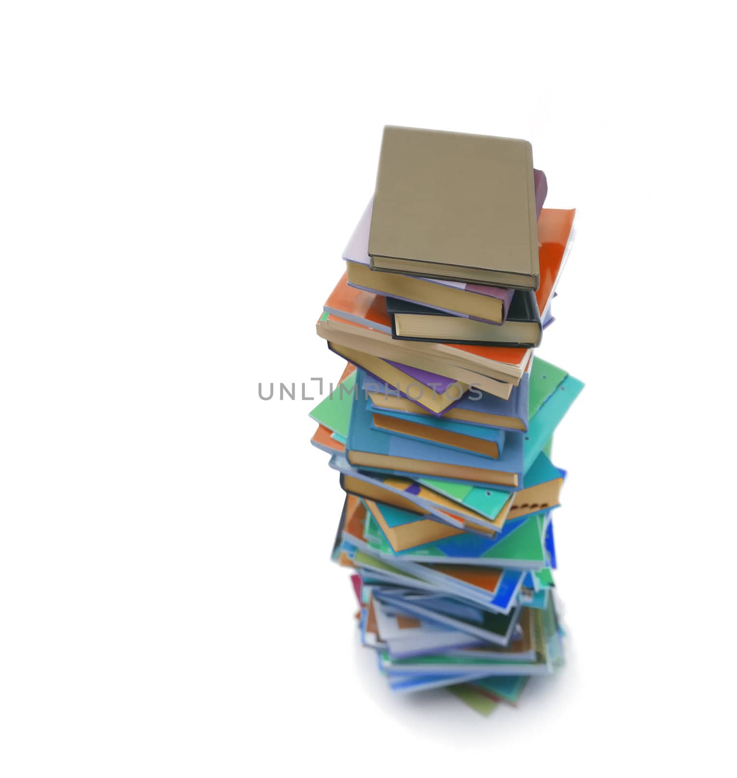 Stack of colorful real books on white background, partial view.