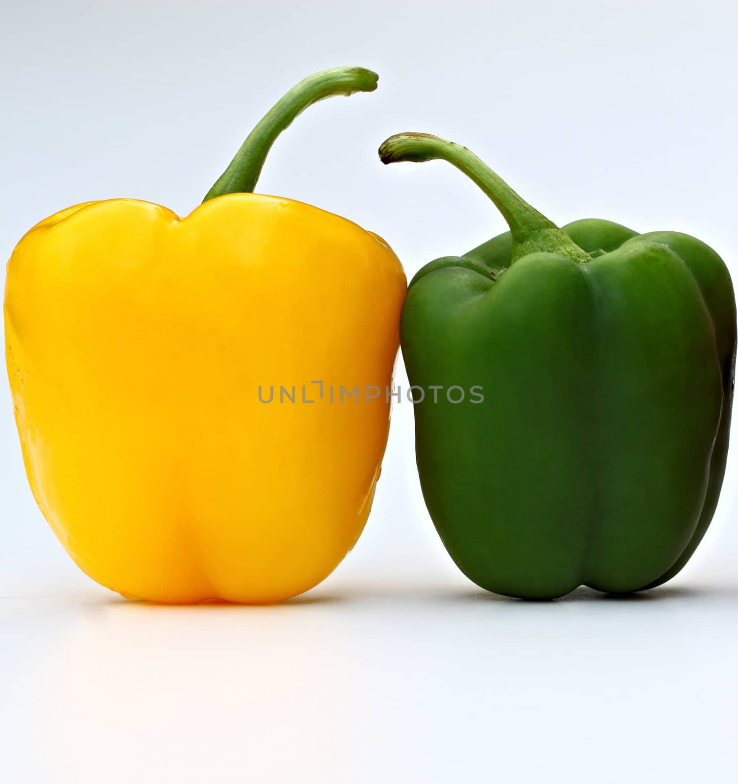 Two pepers isolated on a white background