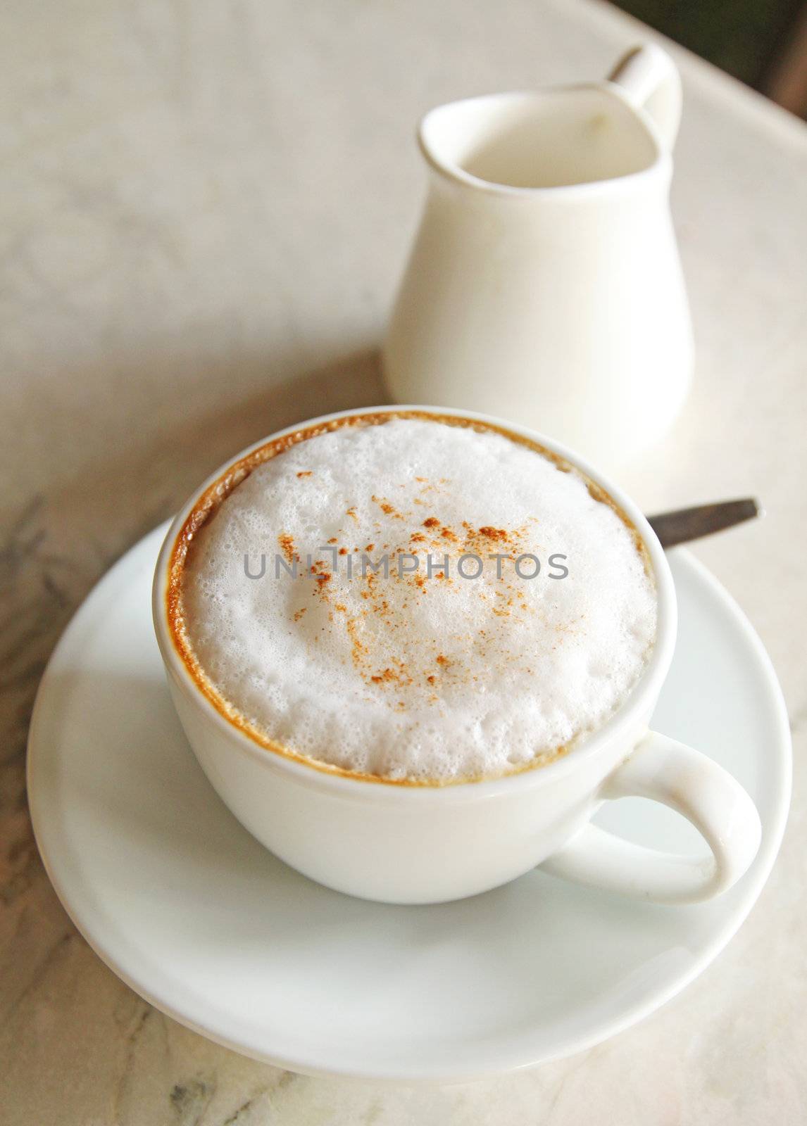a cup of cappuccino or latte coffee with milk