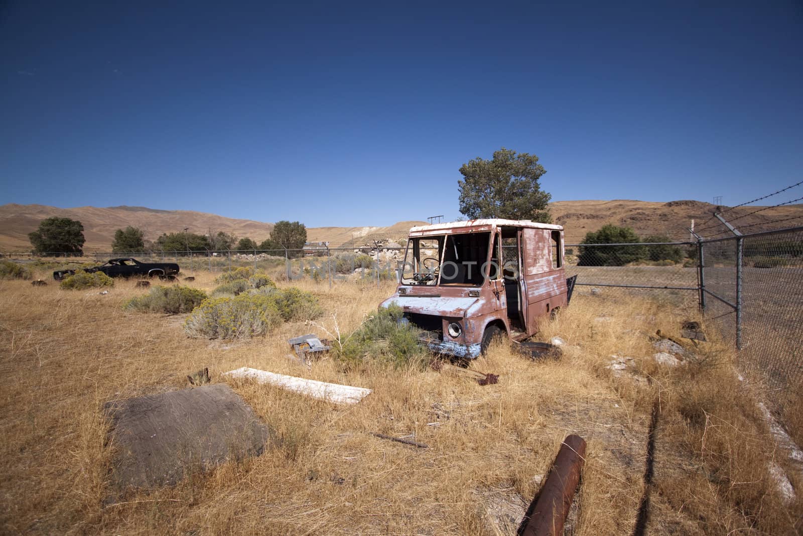 An old rusty abandoned car.