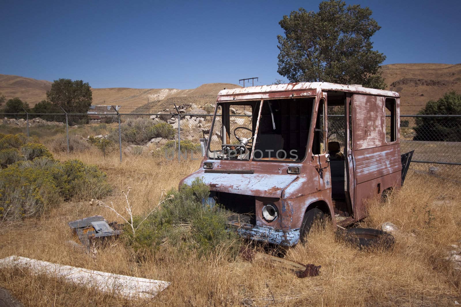 An old rusty abandoned car.