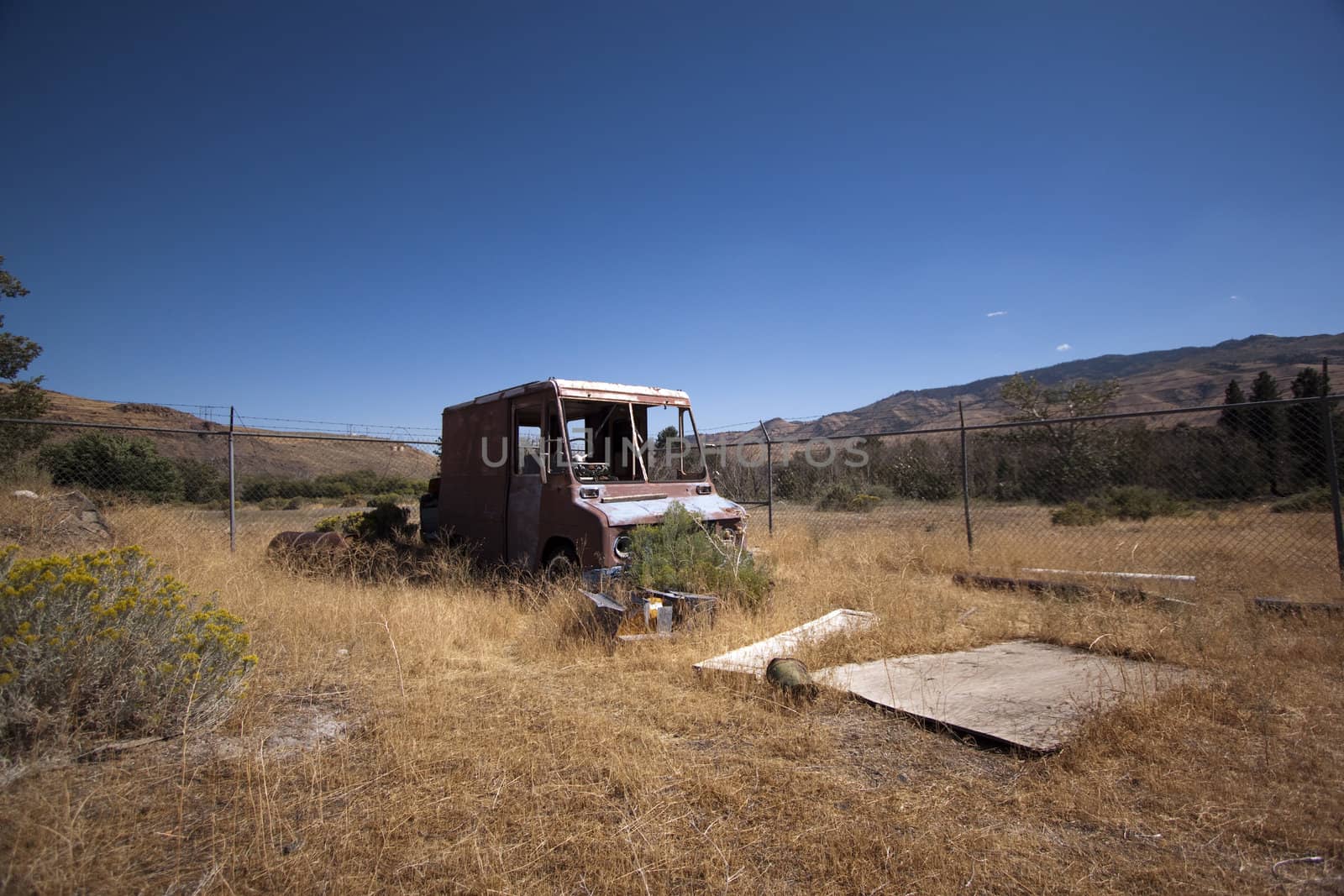 An old rusty abandoned car.