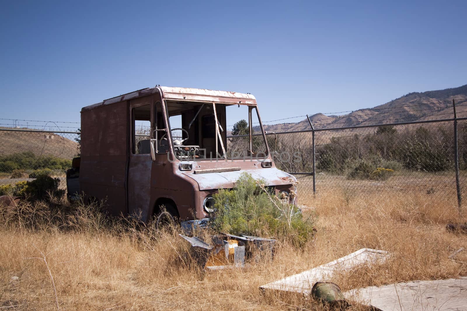 An old rusty abandoned car.