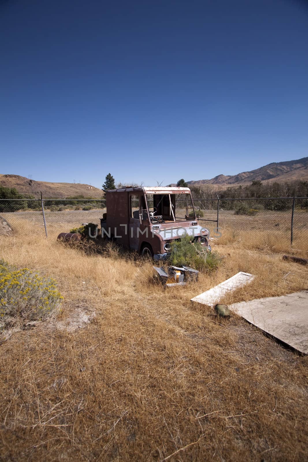 An old rusty abandoned car.