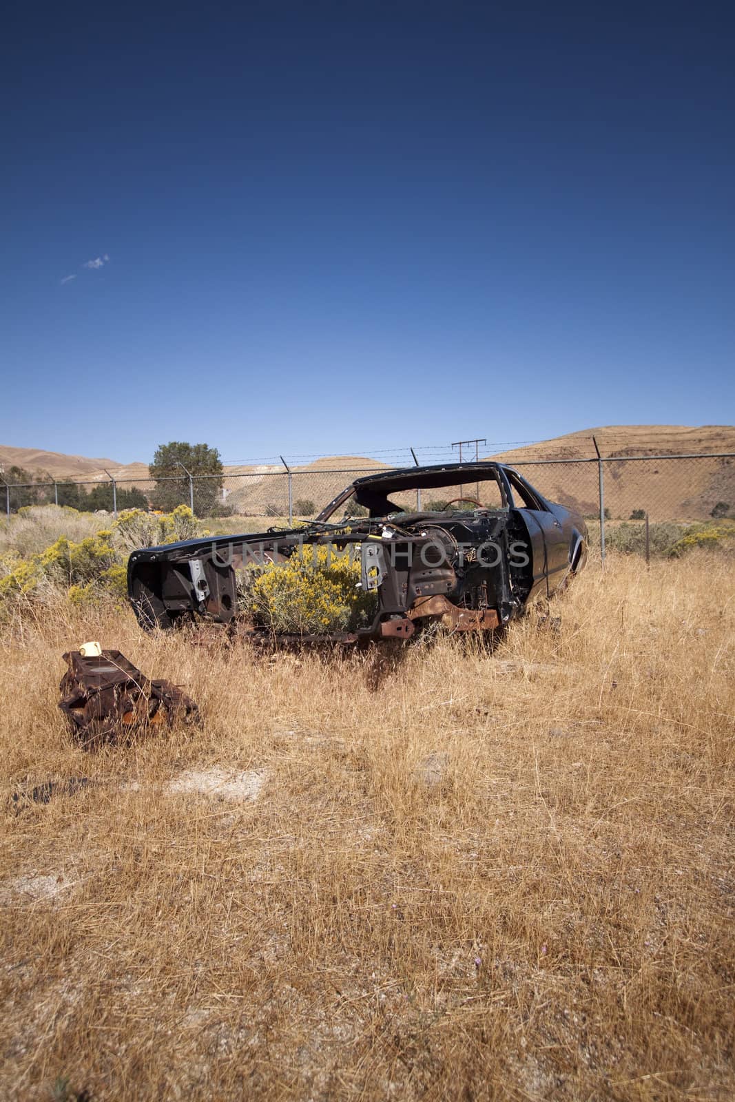 An old rusty abandoned car.