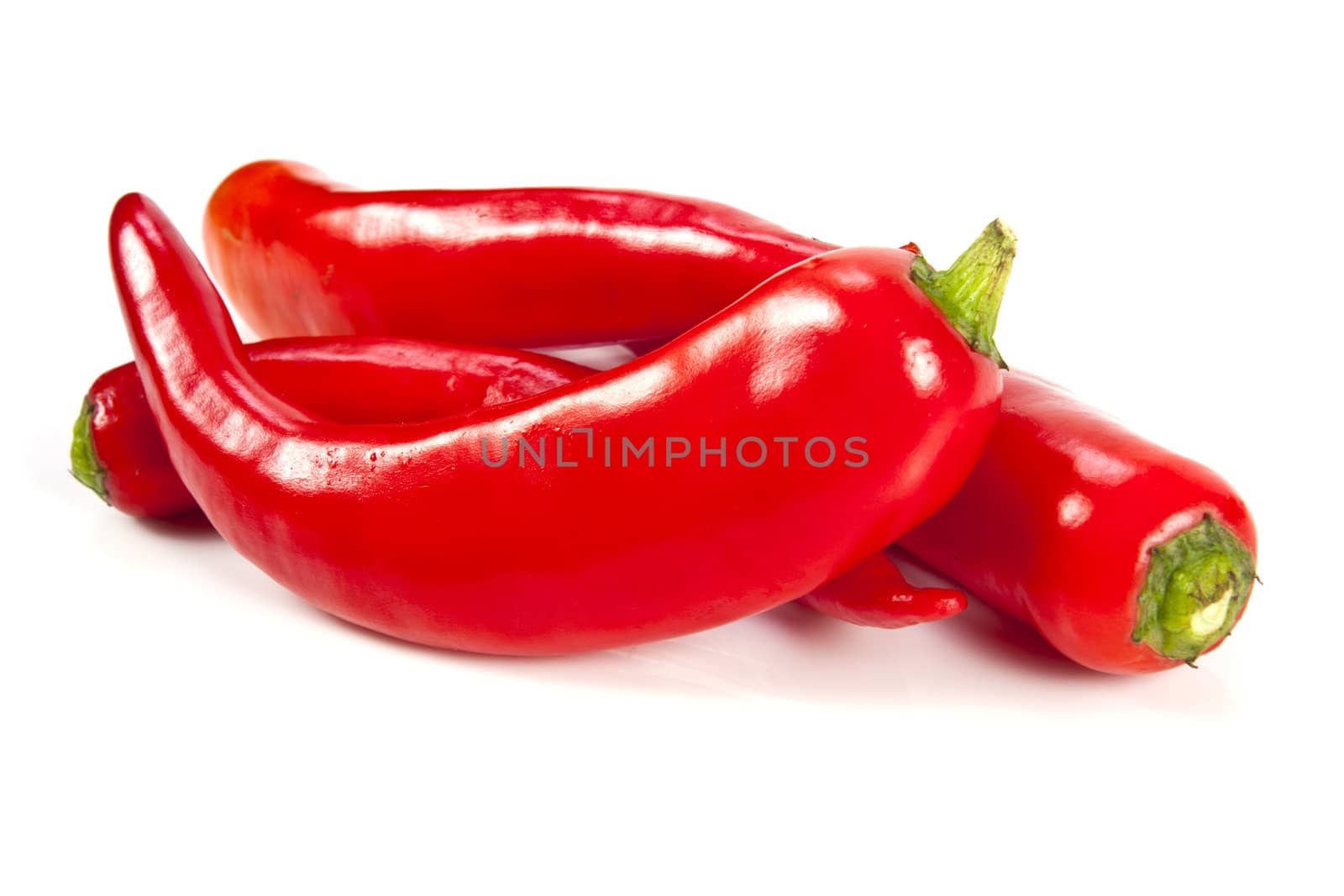 Fresh red hot pepper on a white background