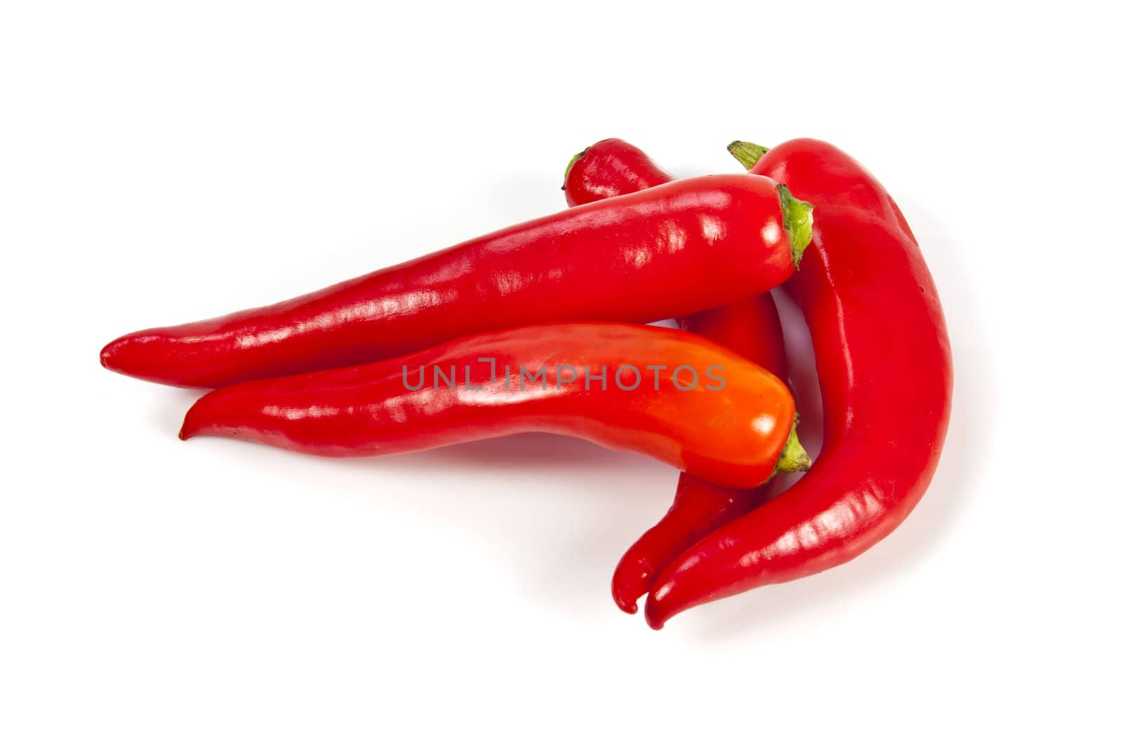 Fresh red hot pepper on a white background