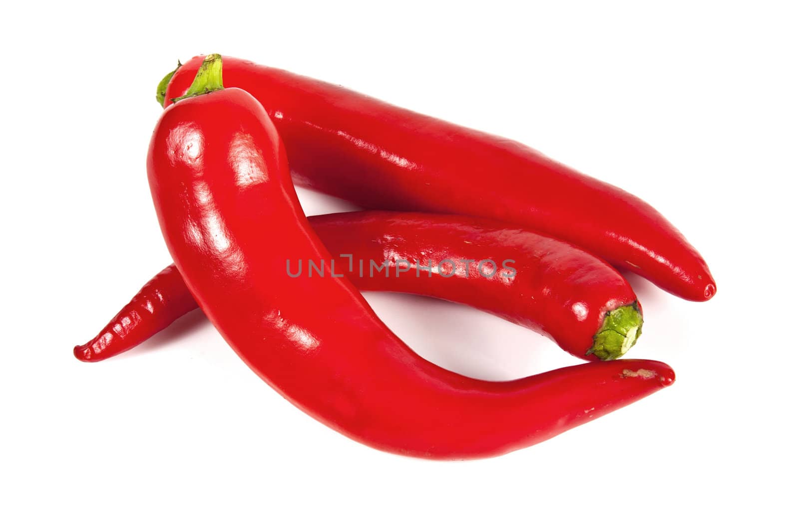 Fresh red hot pepper on a white background