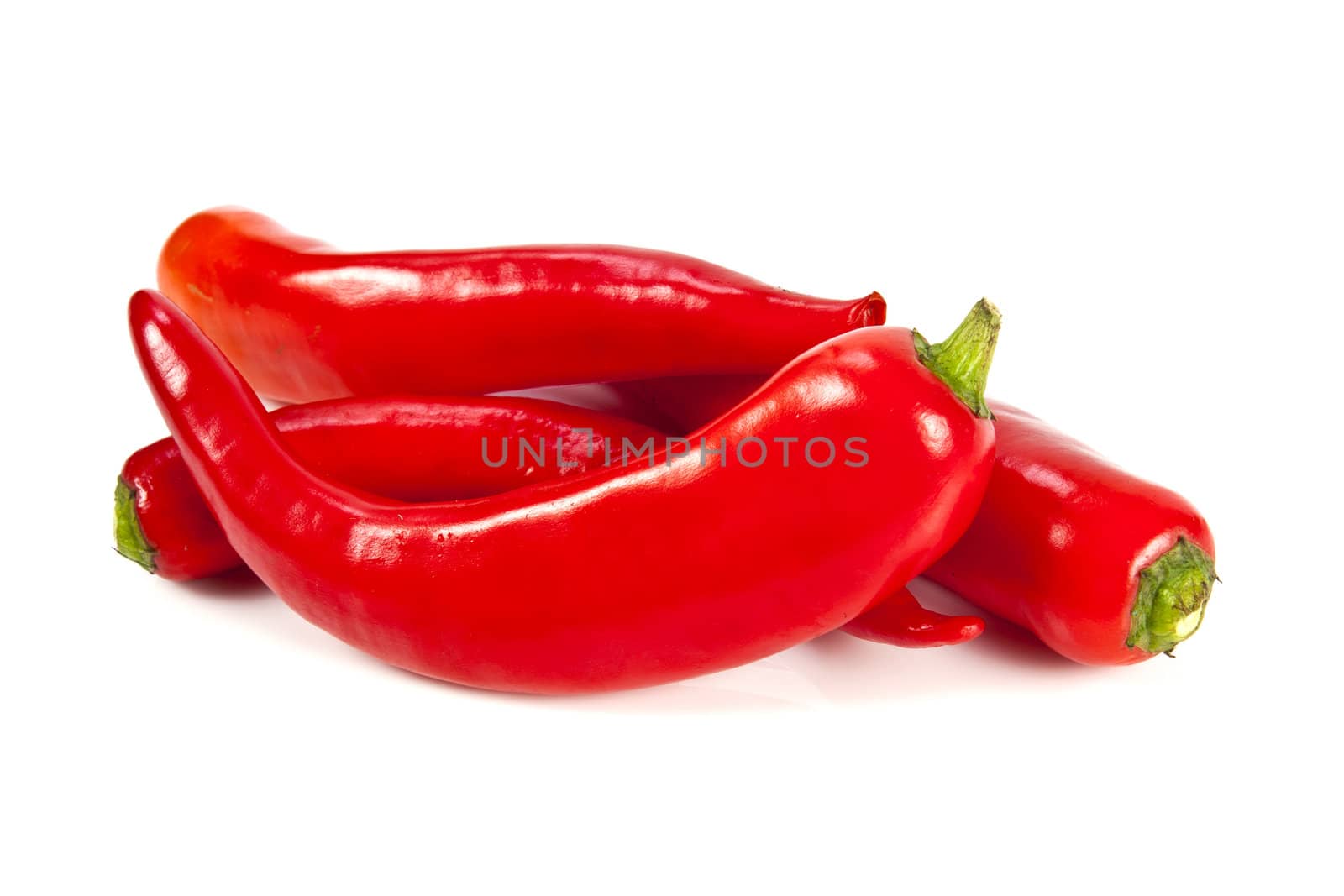 Fresh red hot pepper on a white background