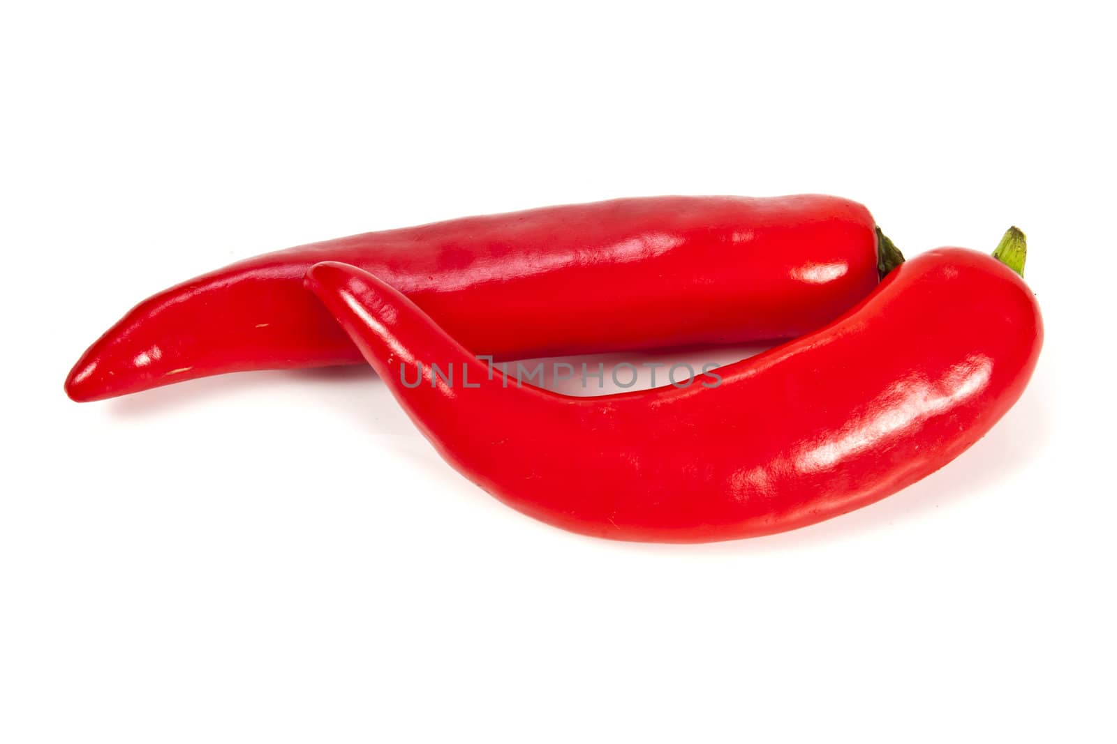 Fresh red hot pepper on a white background