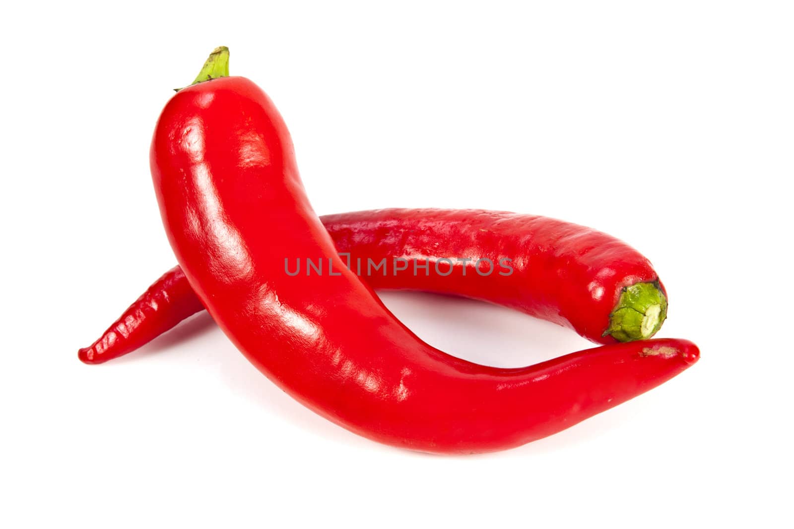 Fresh red hot pepper on a white background