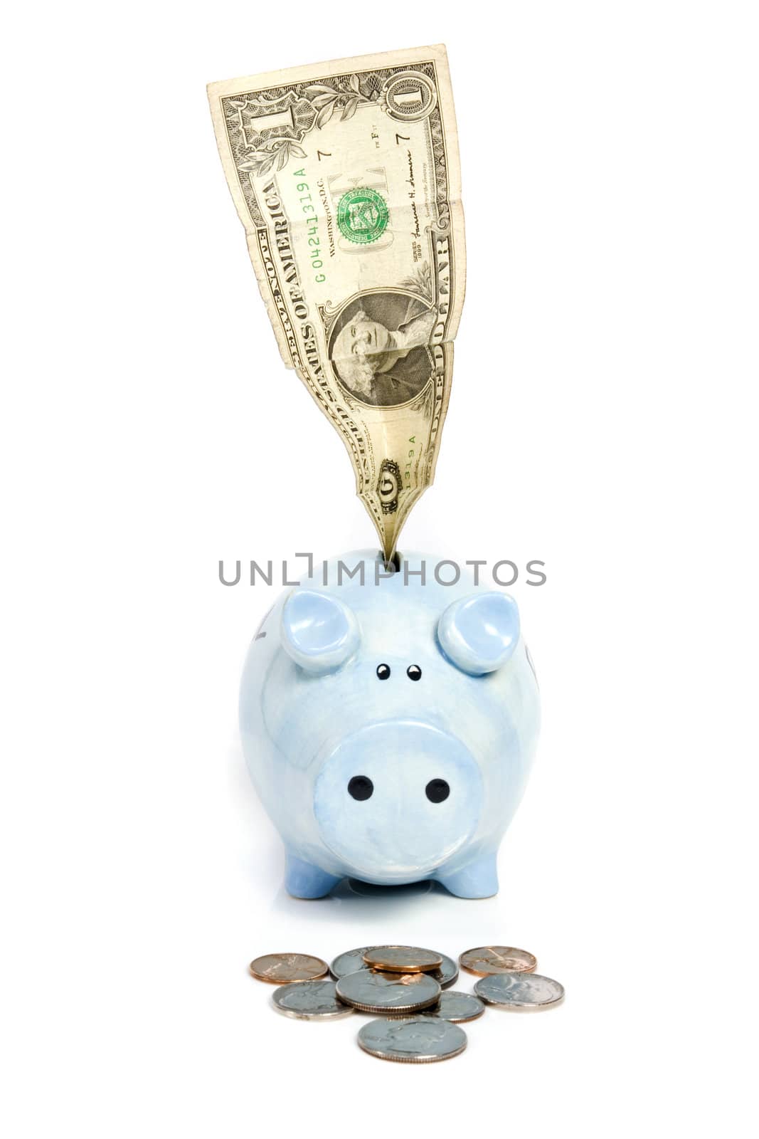 Blue piggy bank savings banknote and coins on white isolated