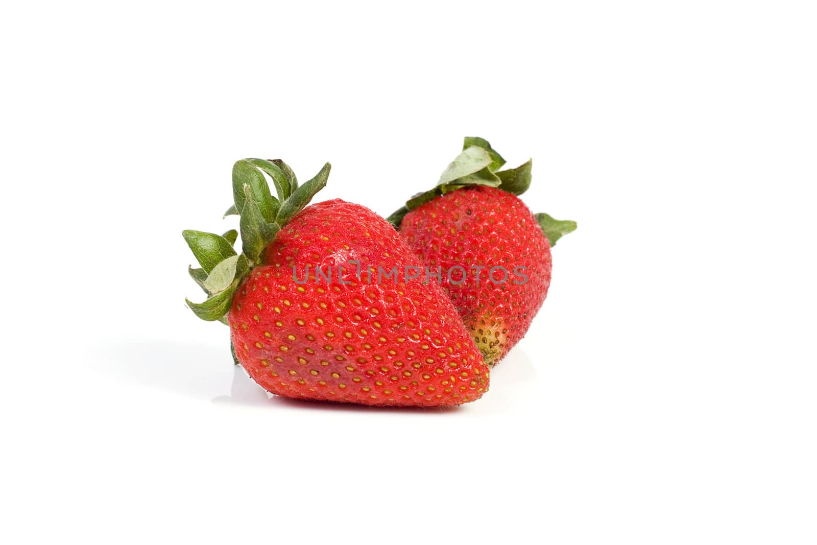 Image of two isolated strawberries with soft shadow.