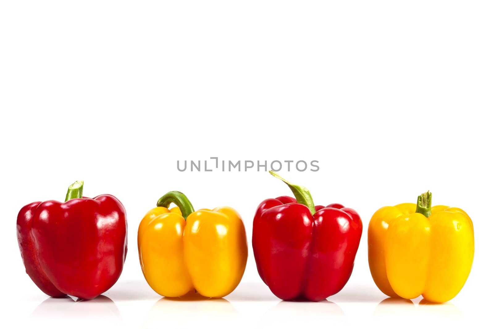 Yellow and red bell pepper on white background with blank text copy space