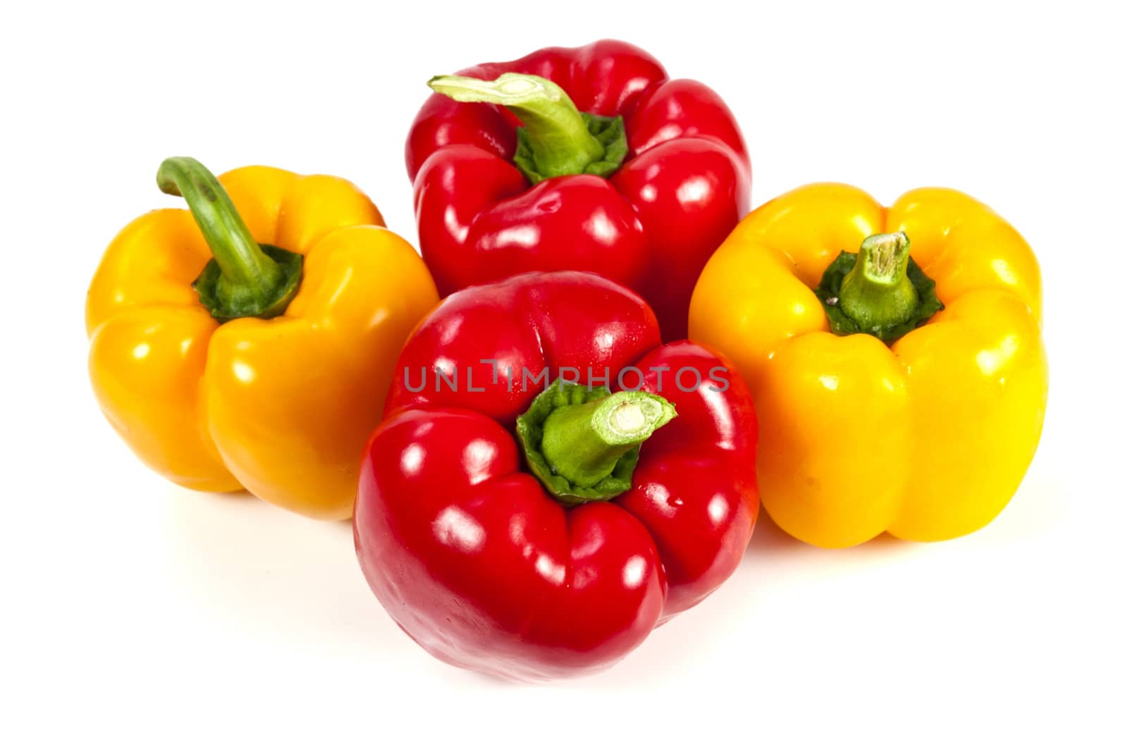 Yellow and red bell pepper on white background