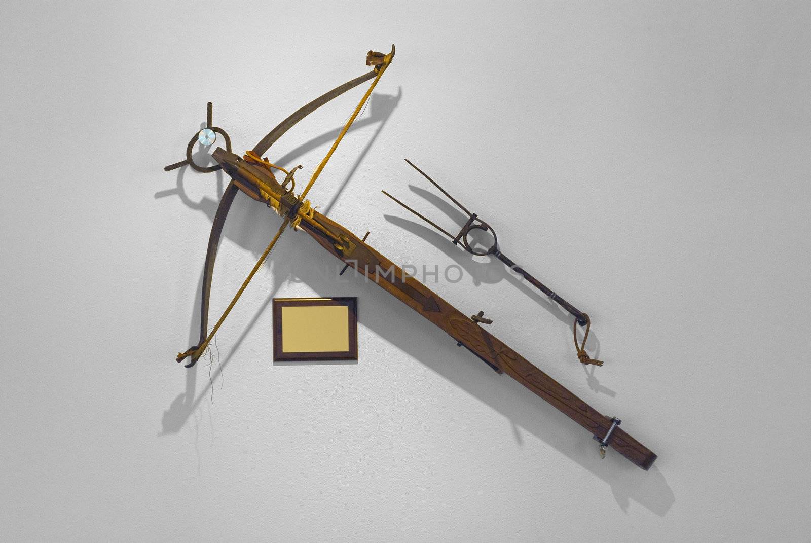 Antique crossbow in exposition with plaque