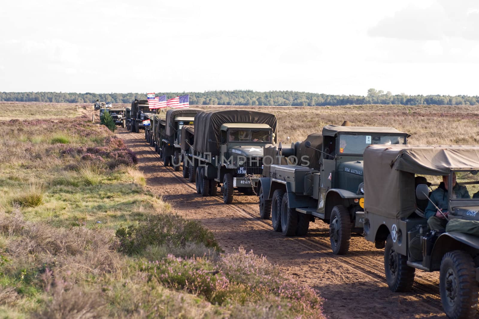 EDE, THE NETHERLANDS - SEPTEMBER 18: Column of World War 2 amr vehicles at Jan Hilgers Memorial / Airborne drop Arnhem 1944 Memorial in Ede, The Netherlands on September 18, 2010