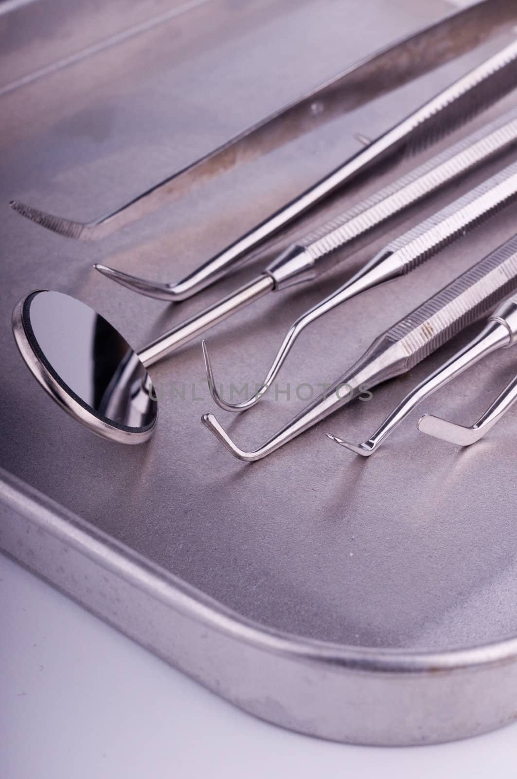 Dentist tools on metal tray