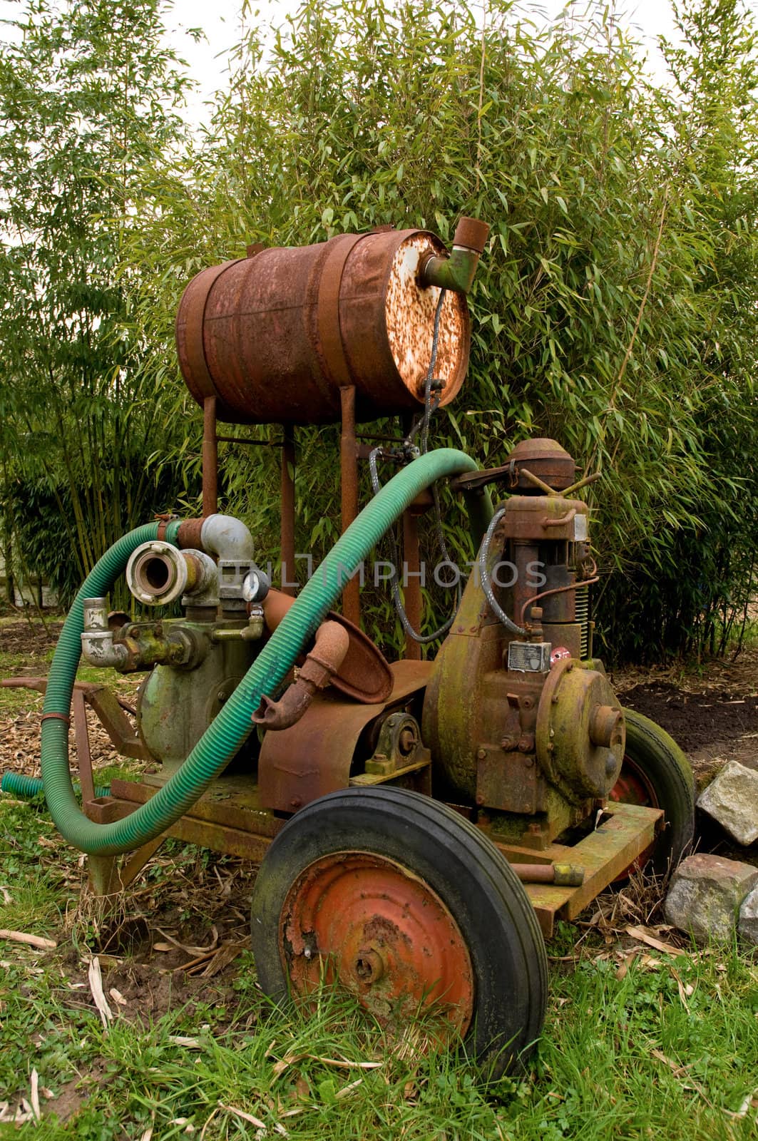 Old and rusty mobile water pump on a plantation