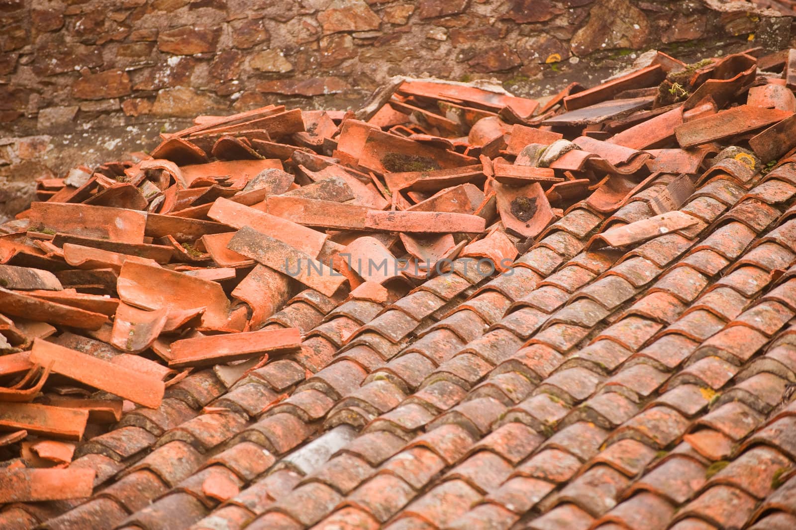 Red clay shingles roof after storm