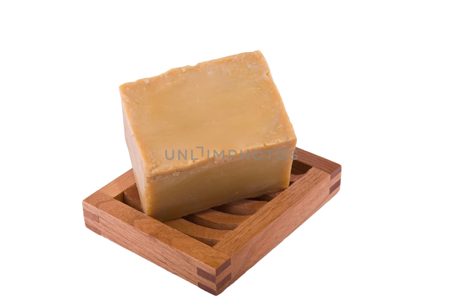 Bar of natural olive oil soap on wooden rack