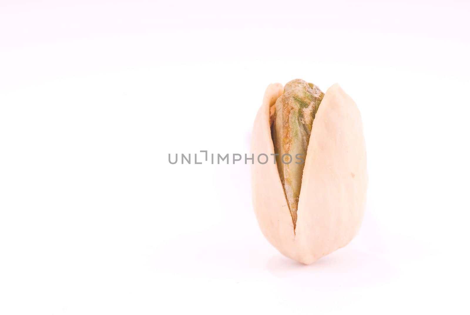 Macro of a pistachio on white 