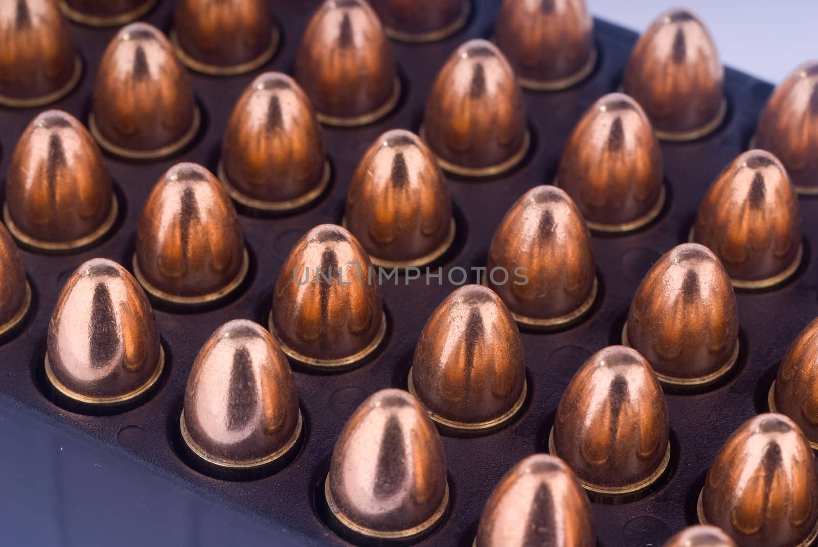 Tray with 9 mm pistol cartridges