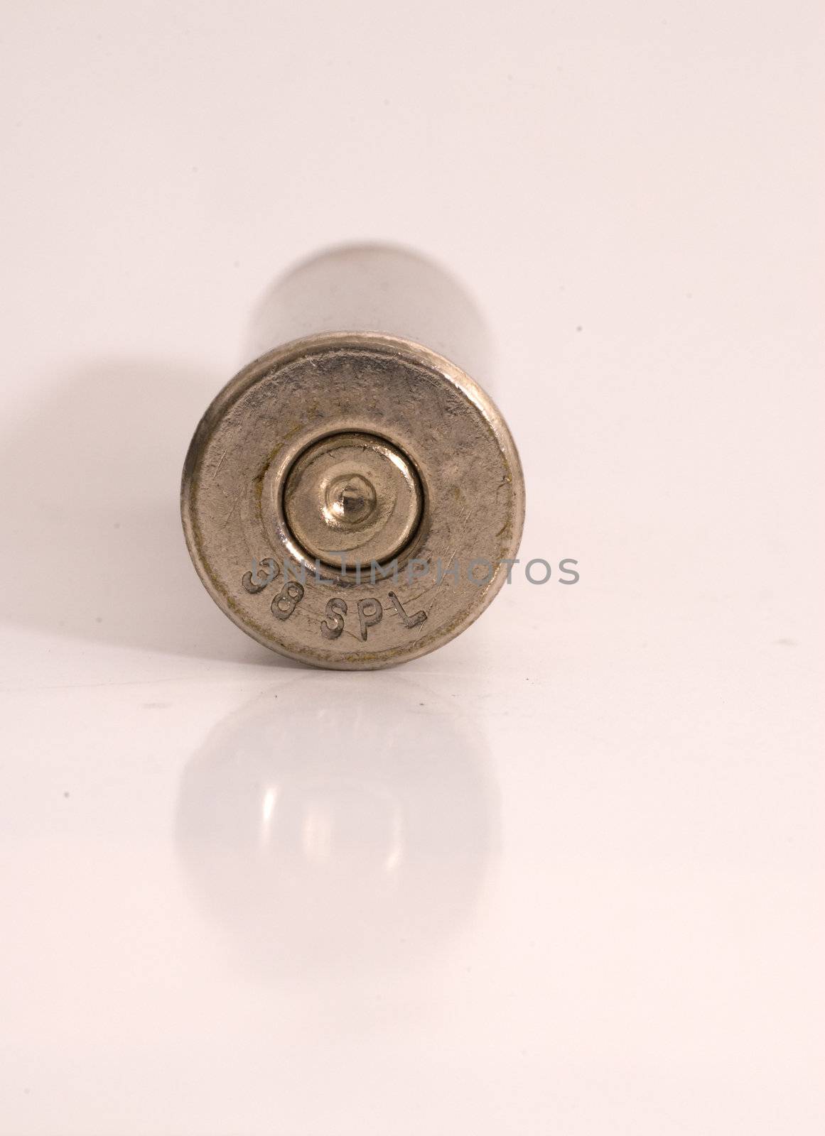 Single dirty nickel .38 Special shell casing