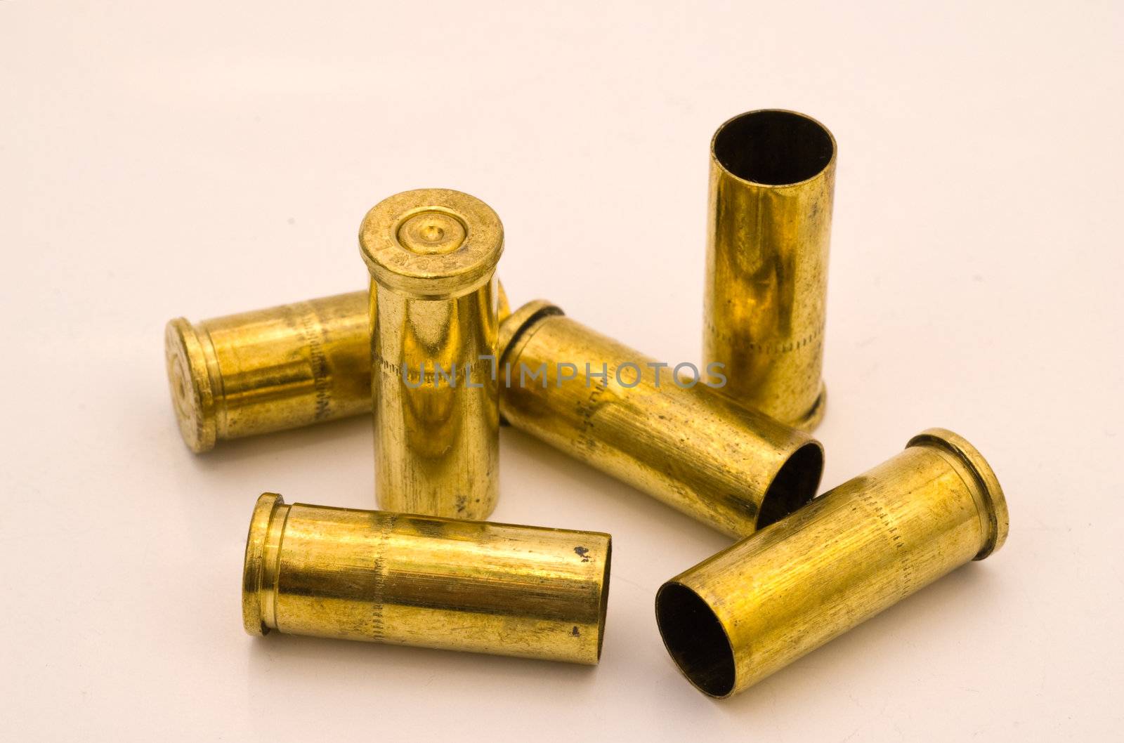 Six dirty .32 S&W revolver shell casings