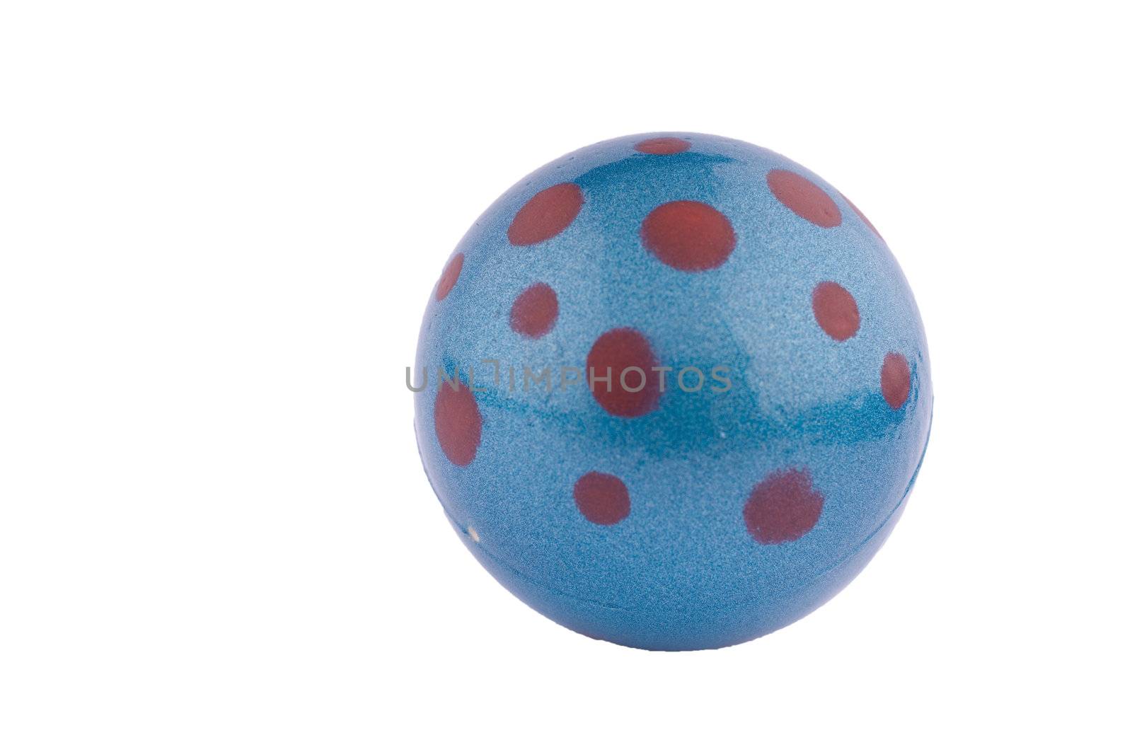 Shiny blue rubber ball with red dots on white