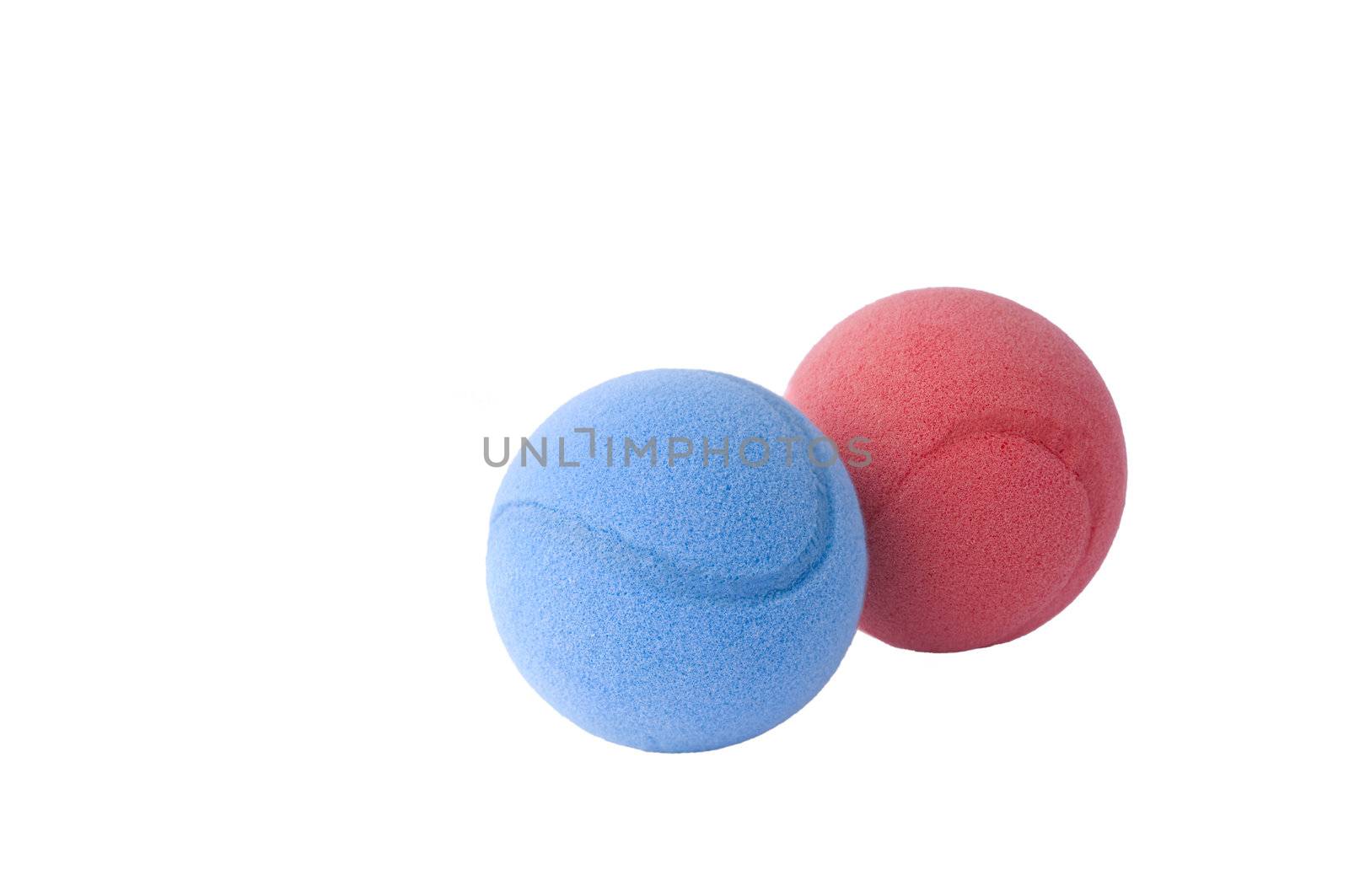 Red and blue foam balls on  white