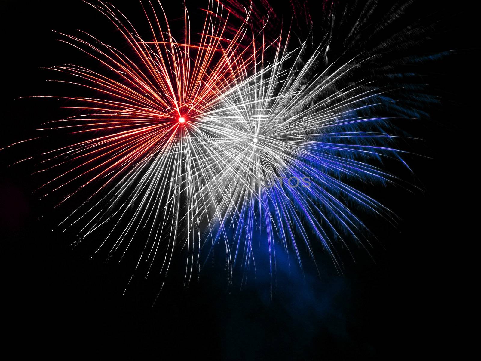 Long Exposure of Red White and Blue Fireworks Against a Black Sky