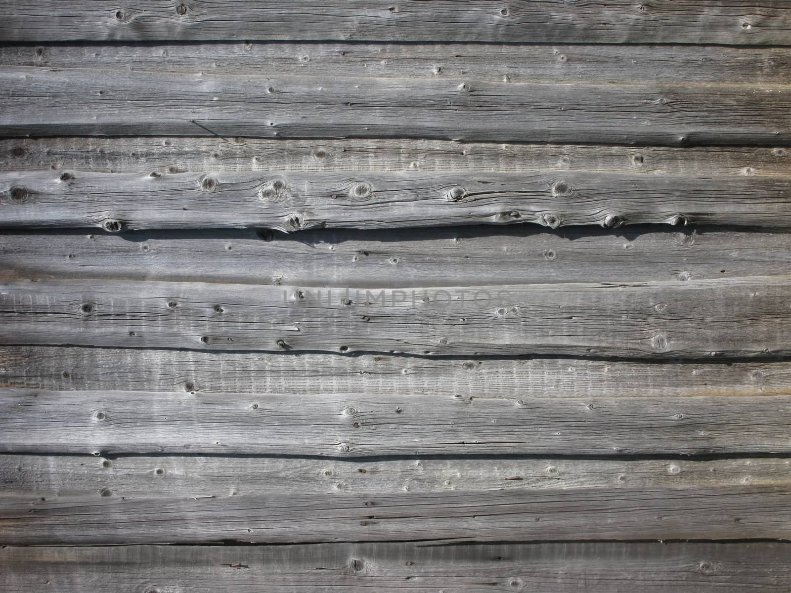 A piece of rough wooden uncolored shed wall