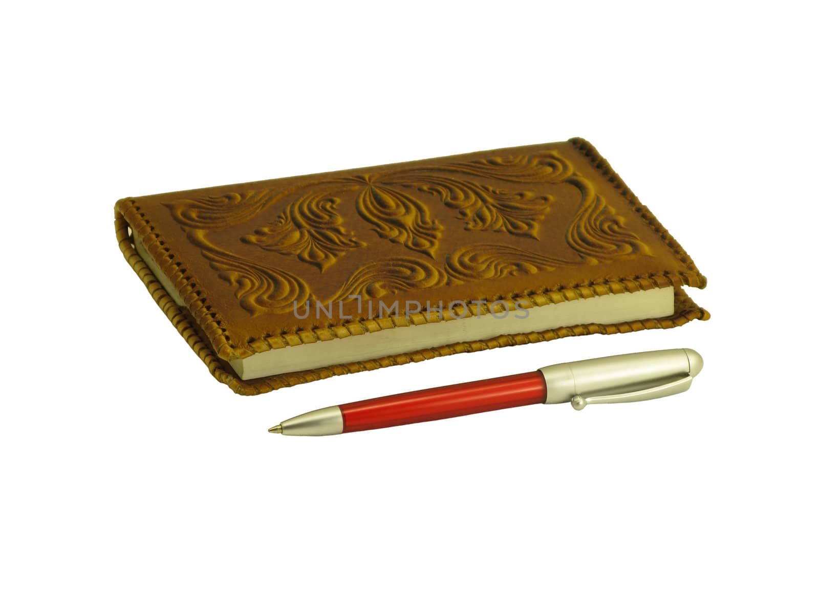 Brown soft leather covered notebook and a pen on a white background